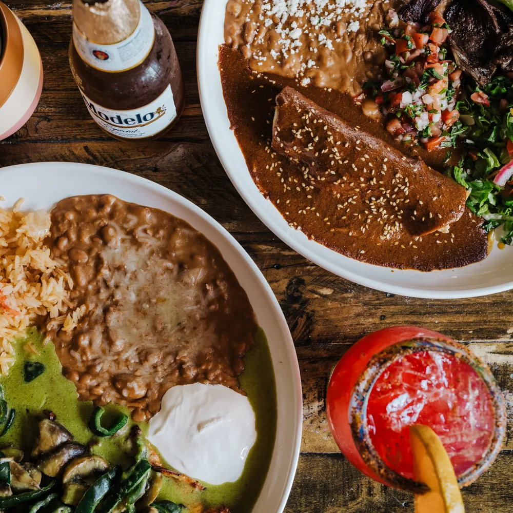 Mole enchiladas with rice, beans and margarita